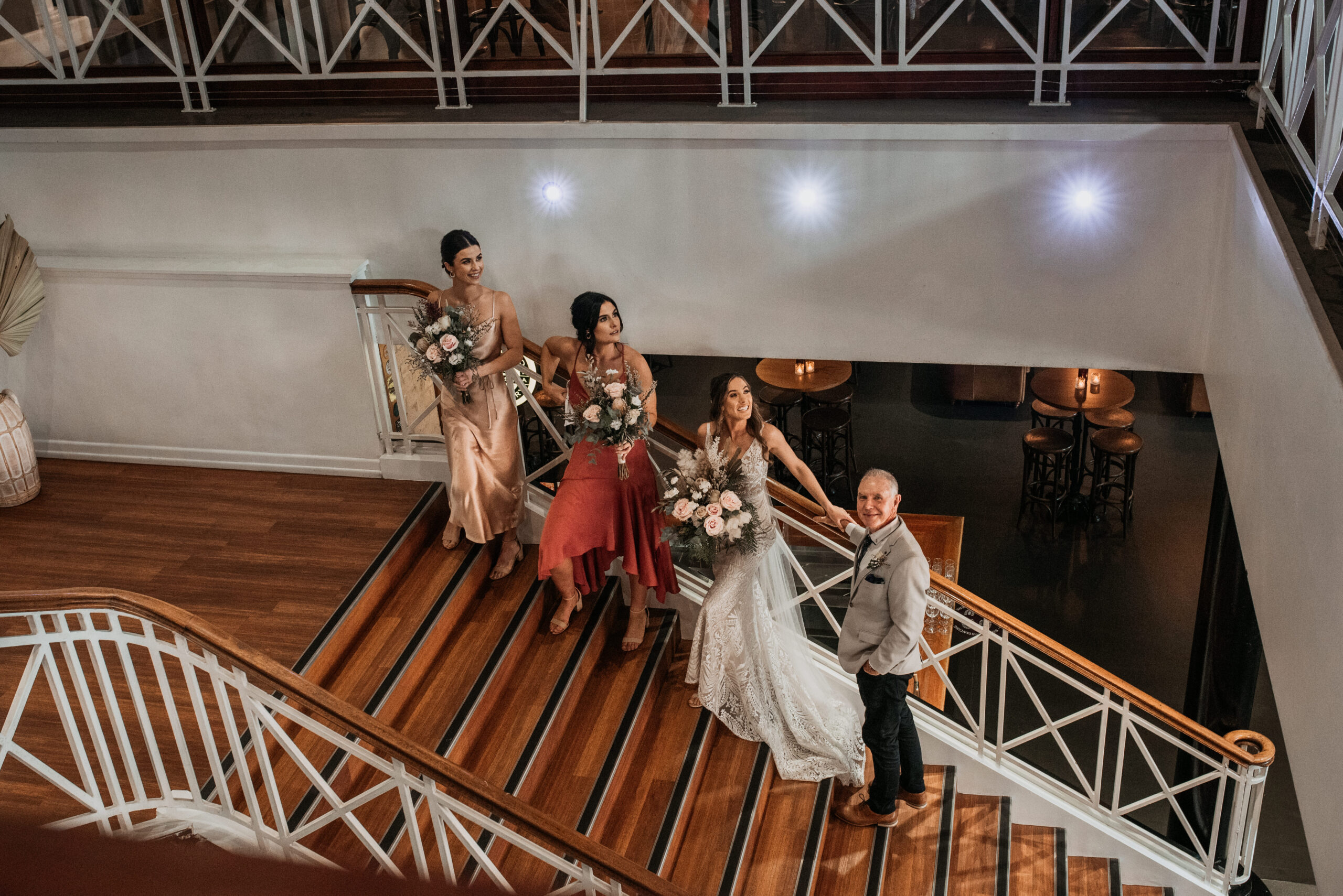 Couple portrait near the historic staircase and balcony details at Transcontinental Hotel
