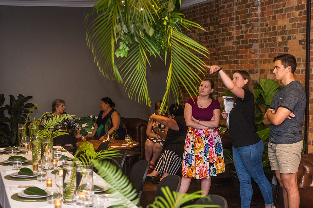 Venue team explaining reception styling options during a Transcontinental Hotel walkthrough