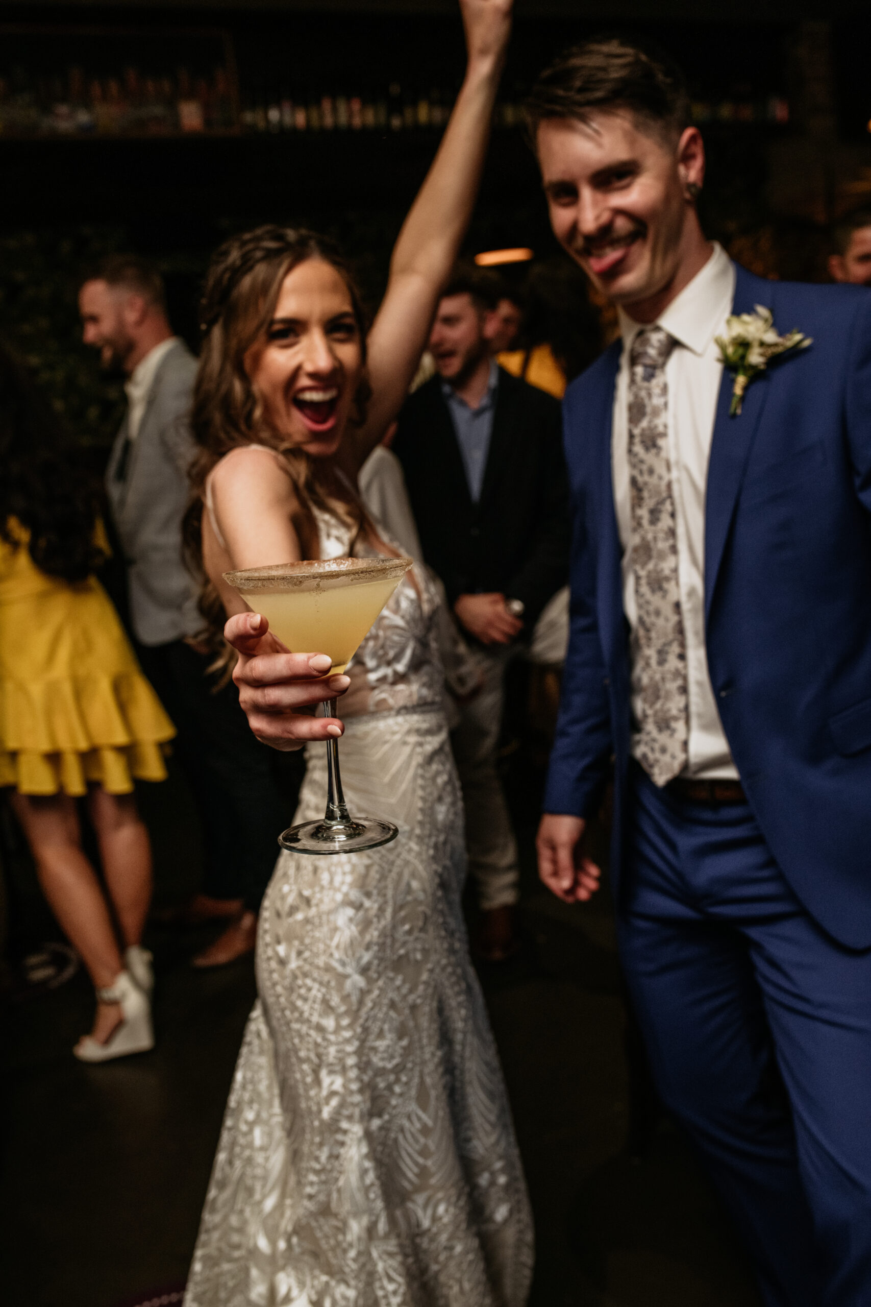 Newlyweds celebrating with cocktails during a Brisbane wedding reception