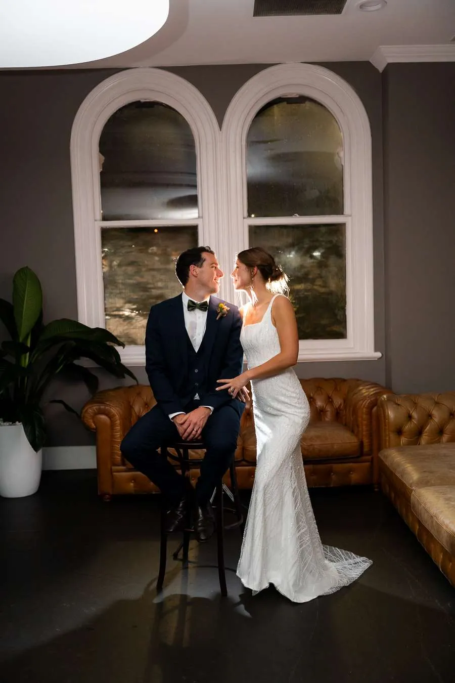 Couple portrait inside a warm Brisbane heritage wedding venue in the evening